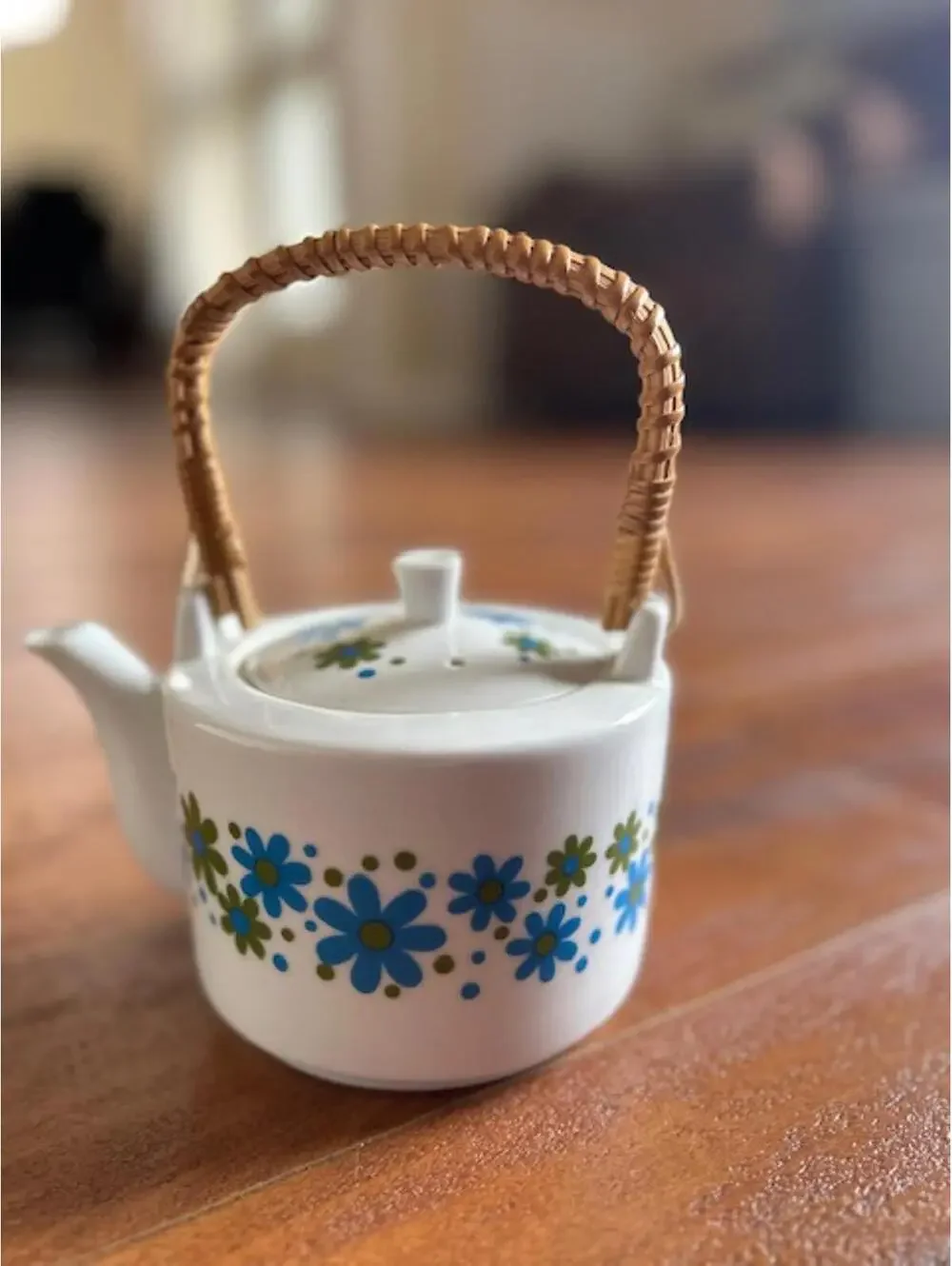 Vintage Ceramic Teapot with Blue and Green Floral Design and Woven Handle